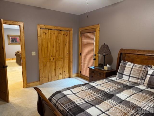 89 Springhouse Drive, Unit A4 Elk Park, NC 28622 - Photo 25 of 40 a bedroom with a bed and wooden floor