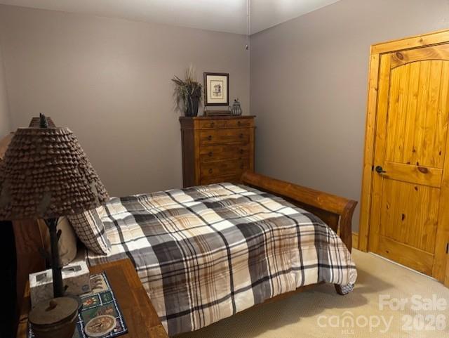 89 Springhouse Drive, Unit A4 Elk Park, NC 28622 - Photo 27 of 40 a bedroom with a bed and dresser