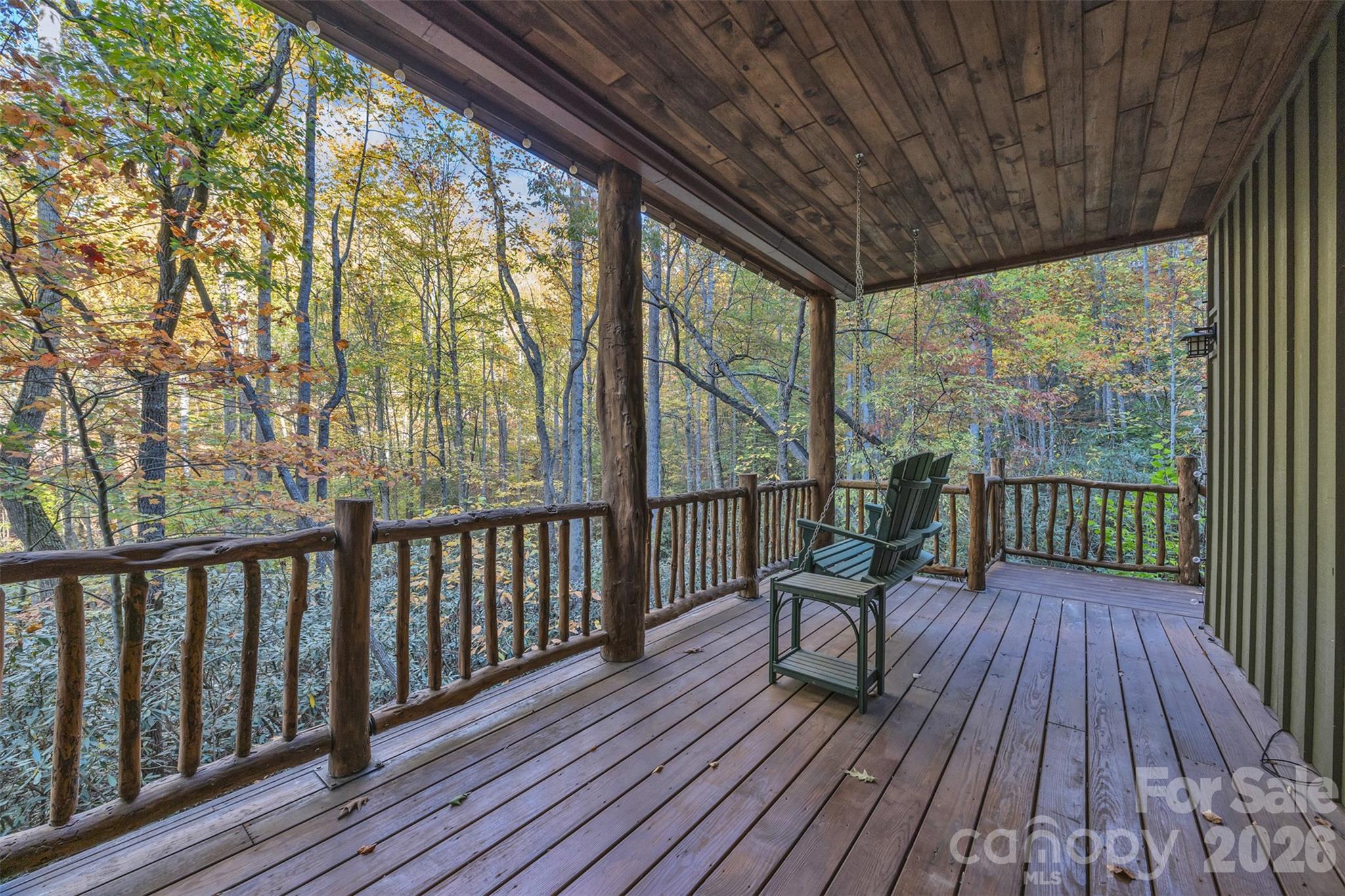 89 Springhouse Drive, Unit A4 Elk Park, NC 28622 - Photo 29 of 40 a view of a two chairs with wooden floor
