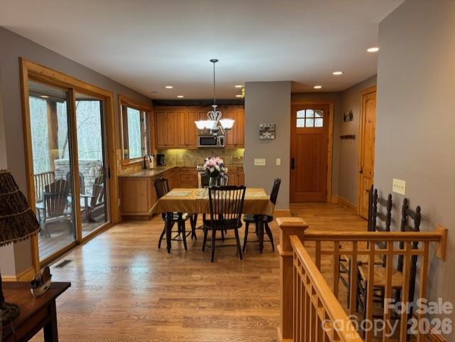89 Springhouse Drive, Unit A4 Elk Park, NC 28622 - Photo 4 of 40 a view of a a dining room with furniture window and wooden floor