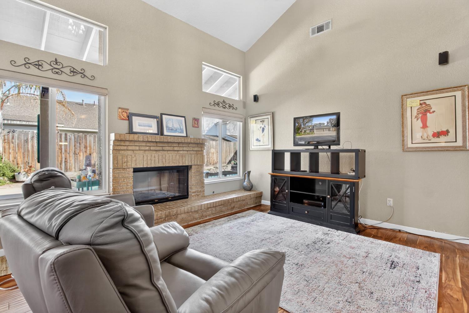 1224 Glenbrook Way Modesto, CA 95355 - Photo 19 of 49 a living room with furniture or couch and a fireplace