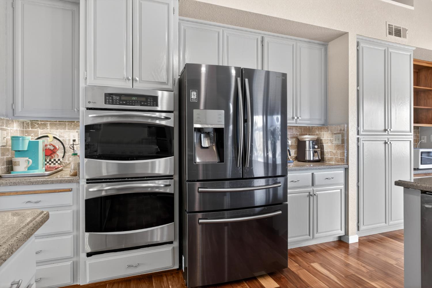 1224 Glenbrook Way Modesto, CA 95355 - Photo 23 of 49 a kitchen with stainless steel appliances and cabinets
