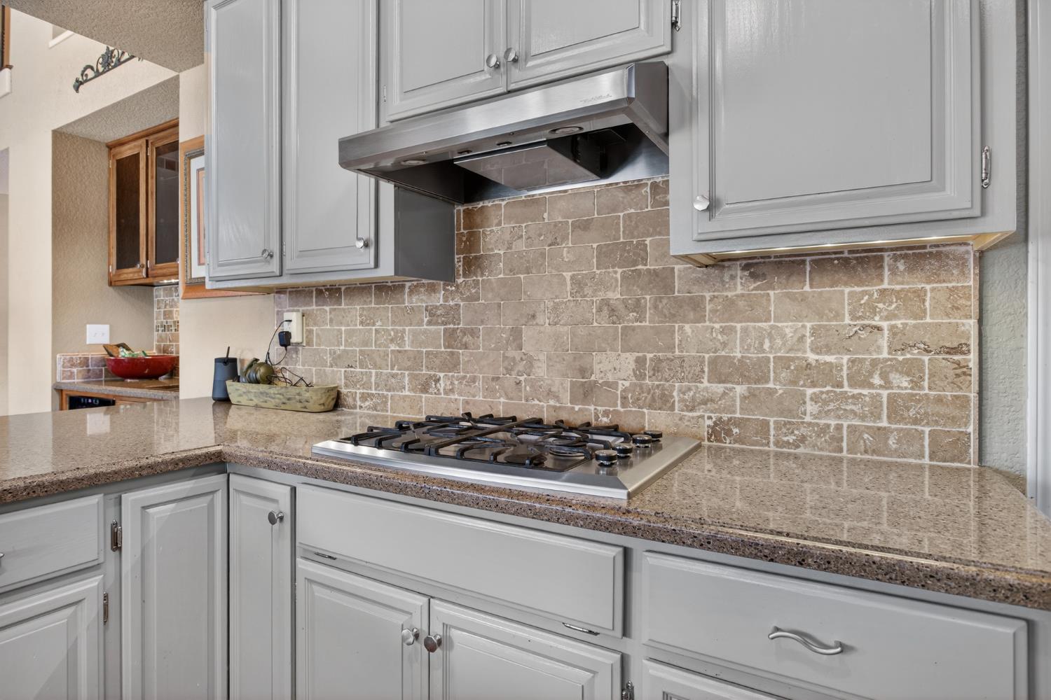 1224 Glenbrook Way Modesto, CA 95355 - Photo 26 of 49 a kitchen with granite countertop white cabinets stainless steel appliances and sink