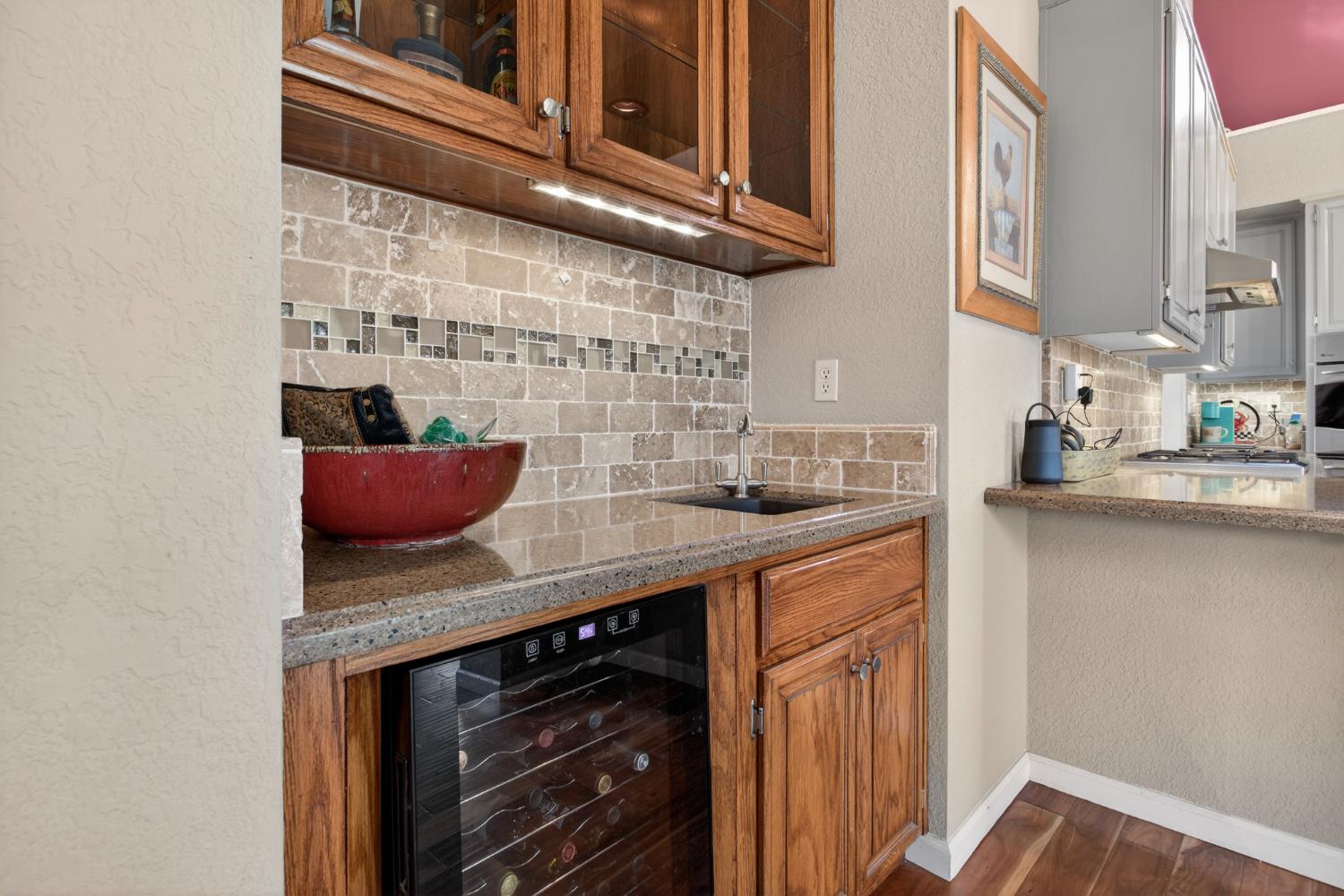 1224 Glenbrook Way Modesto, CA 95355 - Photo 27 of 49 a kitchen with stainless steel appliances granite countertop a sink stove and cabinets