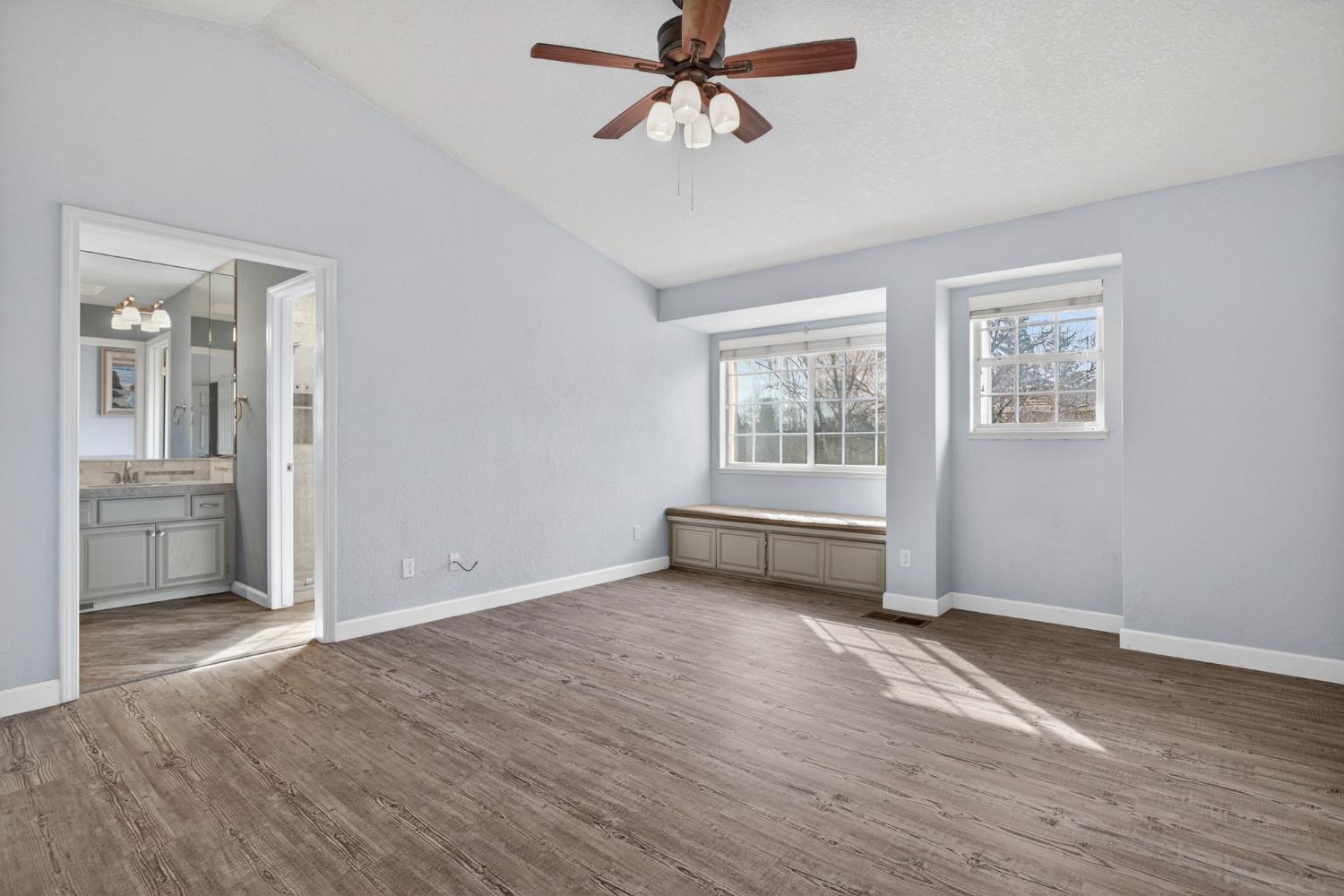 1224 Glenbrook Way Modesto, CA 95355 - Photo 38 of 49 a view of an empty room with a window and wooden floor