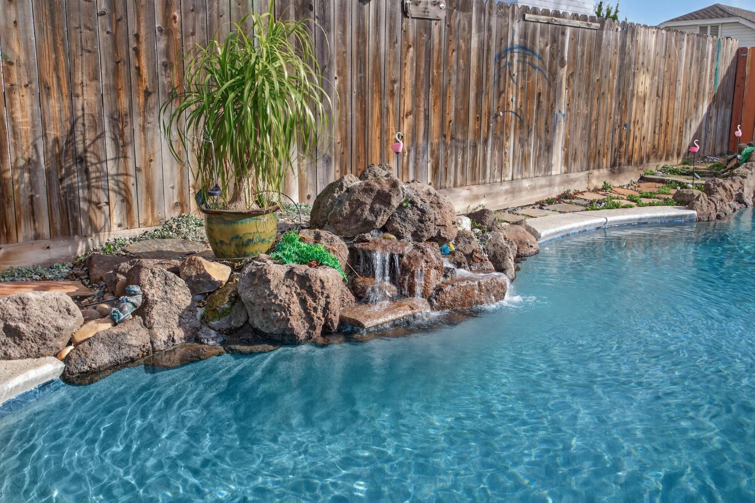 1224 Glenbrook Way Modesto, CA 95355 - Photo 45 of 49 a view of a yard with a fountain