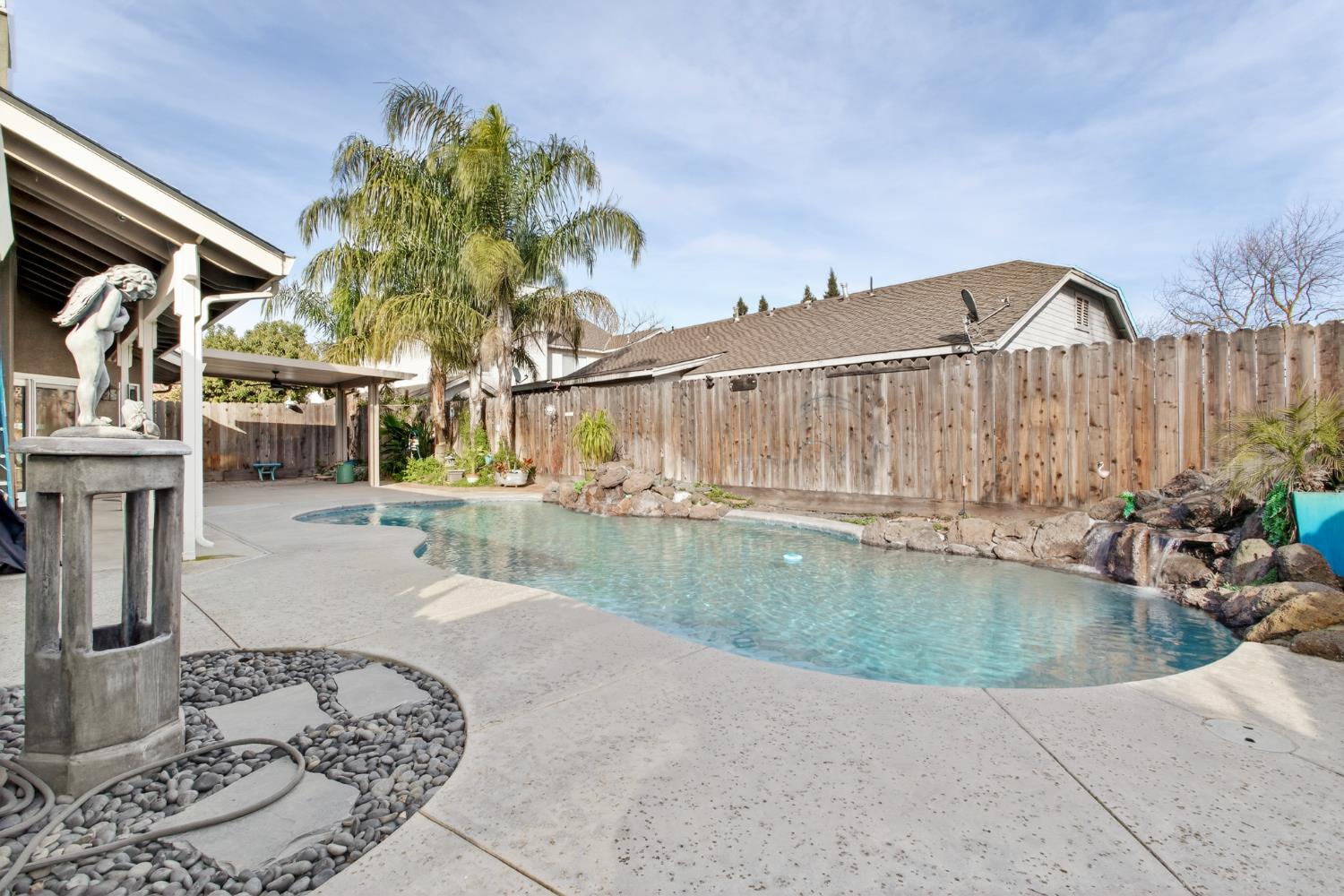 1224 Glenbrook Way Modesto, CA 95355 - Photo 46 of 49 a view of a swimming pool with a patio