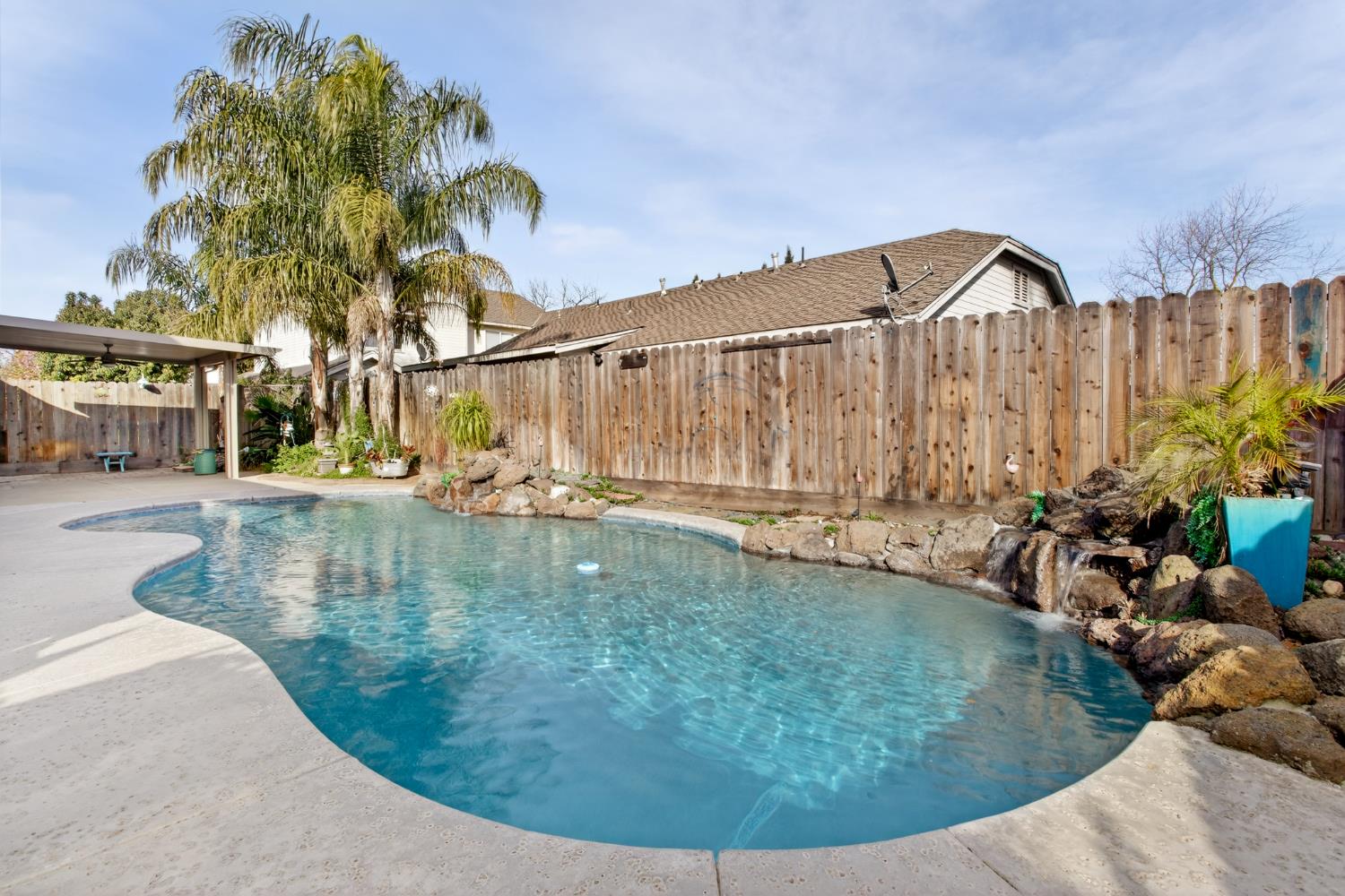 1224 Glenbrook Way Modesto, CA 95355 - Photo 47 of 49 a view of a swimming pool with a garden