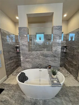 a bathroom with a bathtub and a sink