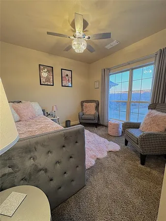 a bedroom with a bed and a couch