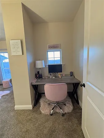 a view of a room with table and chair