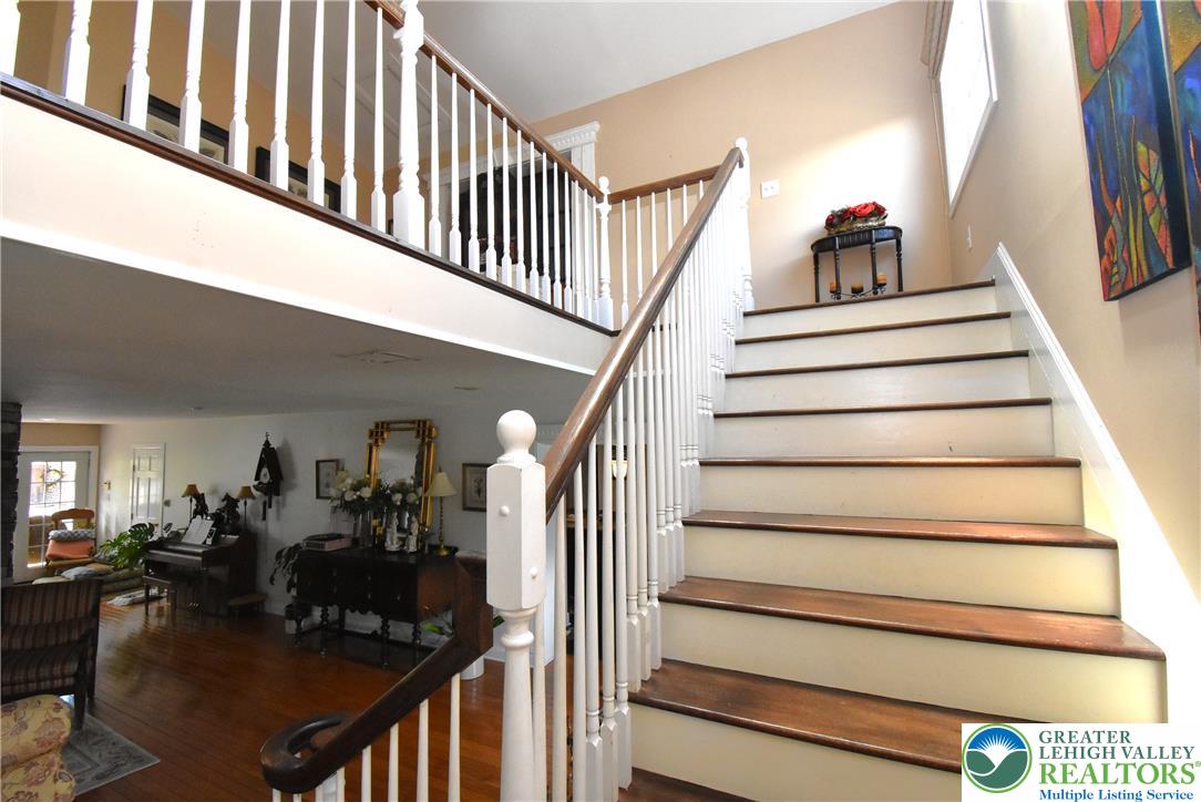424 Grape Street Whitehall, PA 18052 - Photo 34 of 56 This beautiful wooden staircase creates an inviting and grand entrance to the upstairs.