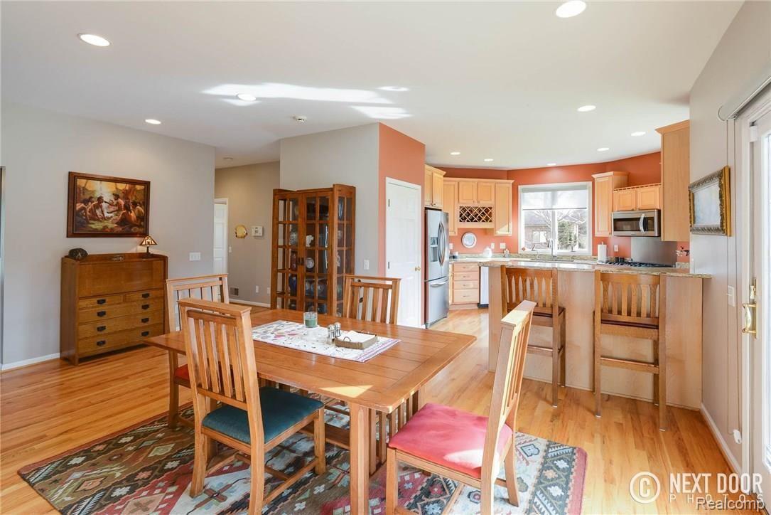 4886 Pleasant Valley Road Brighton, MI 48114 - Photo 51 of 51 Open floor plan, from great room to dining space to snack bar to kitchen.