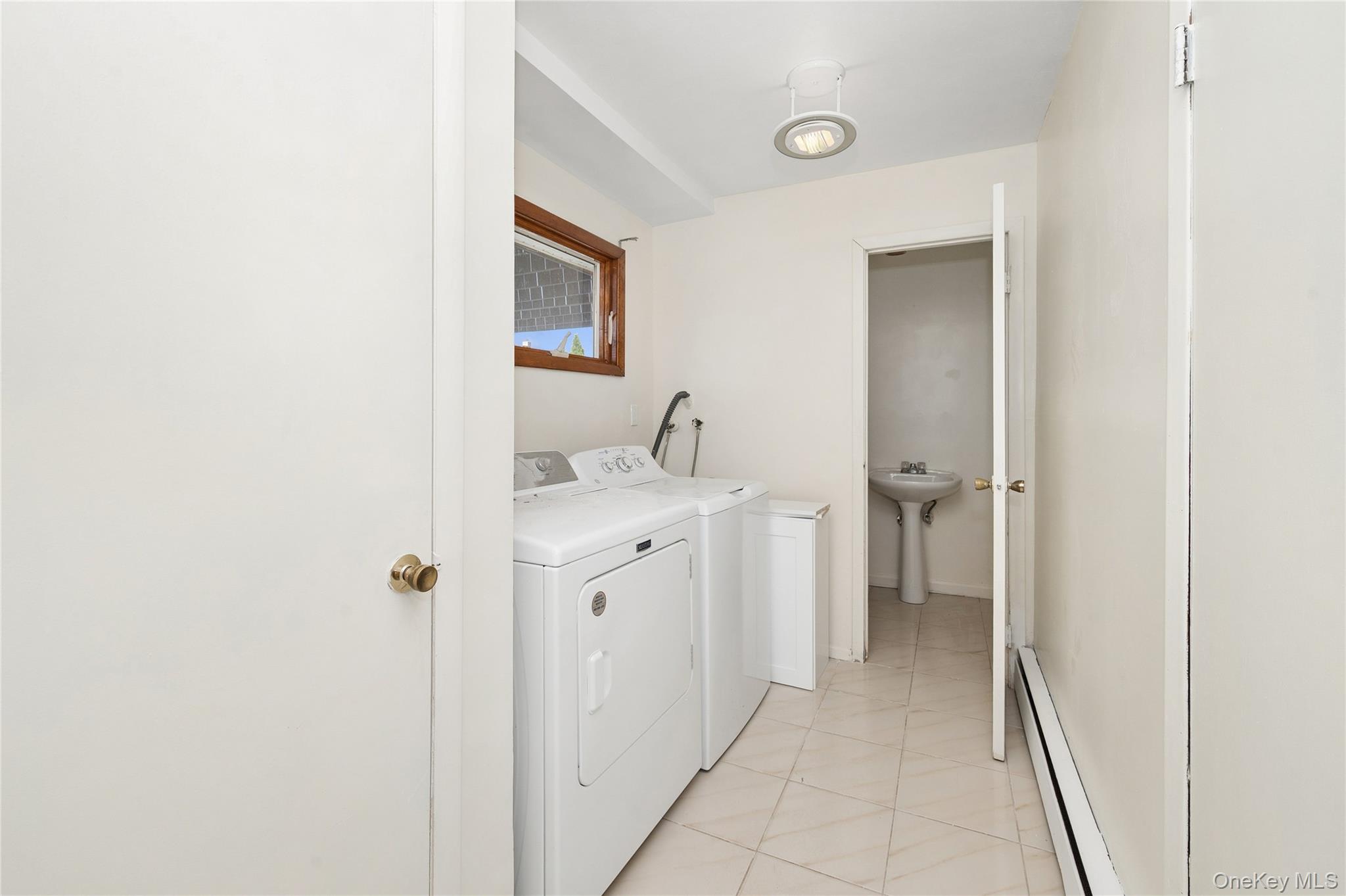 2625 Riverside Drive Wantagh, NY 11793 - Photo 13 of 20 a bathroom with a sink and a mirror
