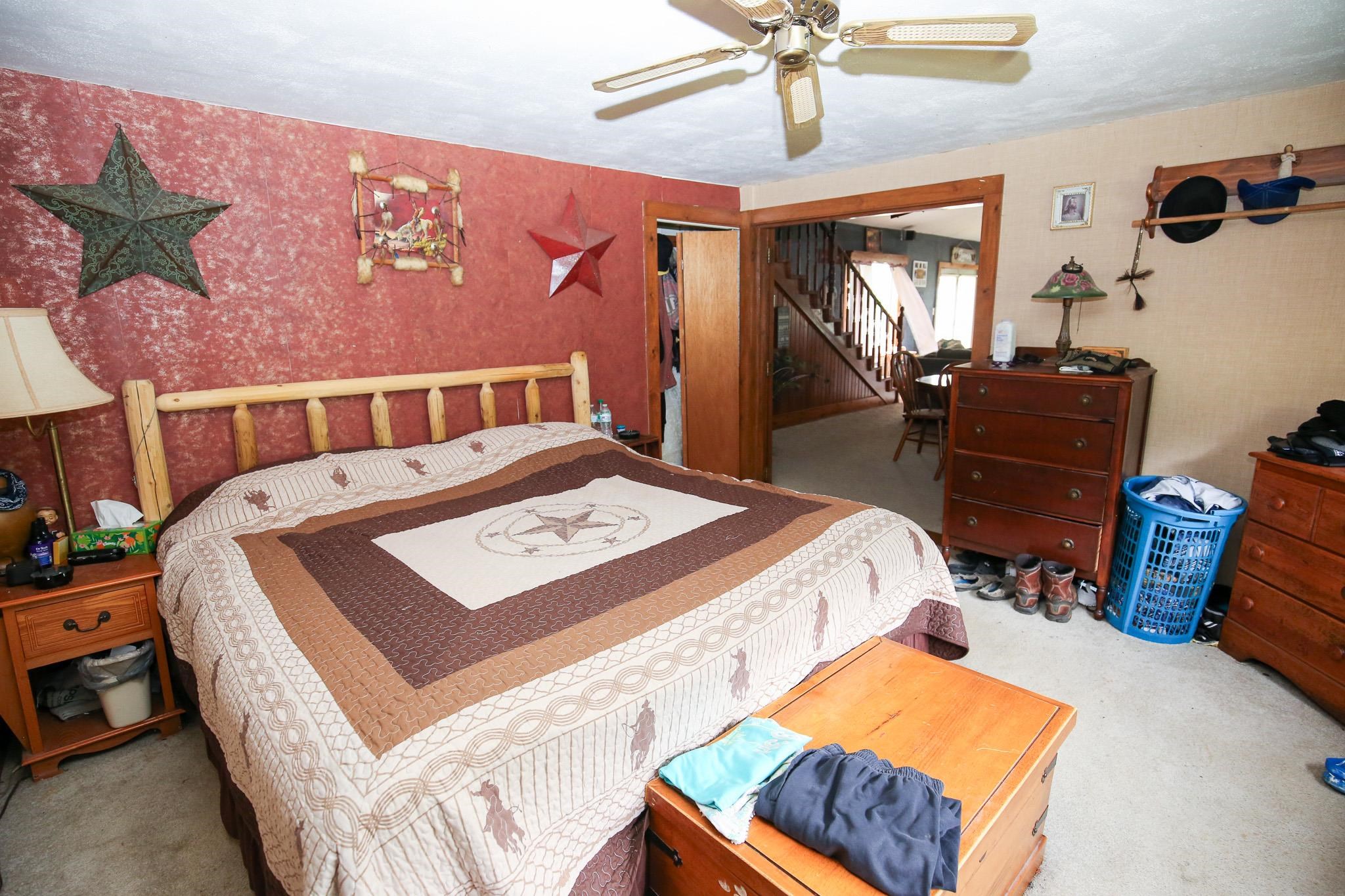2144 Swarts Road Dixon, IL 61021 - Photo 12 of 31 a bedroom with a bed and dresser with mirror