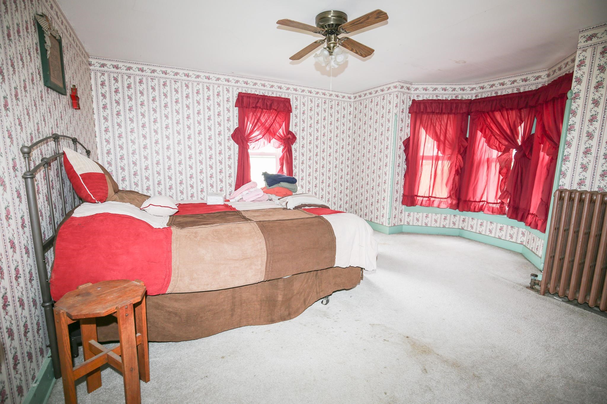 2144 Swarts Road Dixon, IL 61021 - Photo 15 of 31 a bedroom with a bed and a painting on the wall