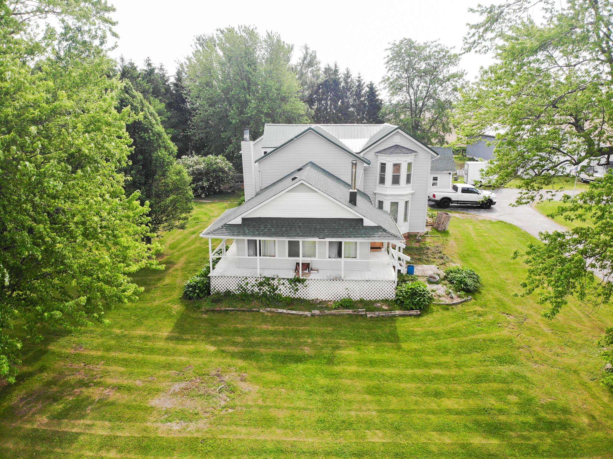 2144 Swarts Road Dixon, IL 61021 - Photo 17 of 31 a front view of a house with a yard and trees