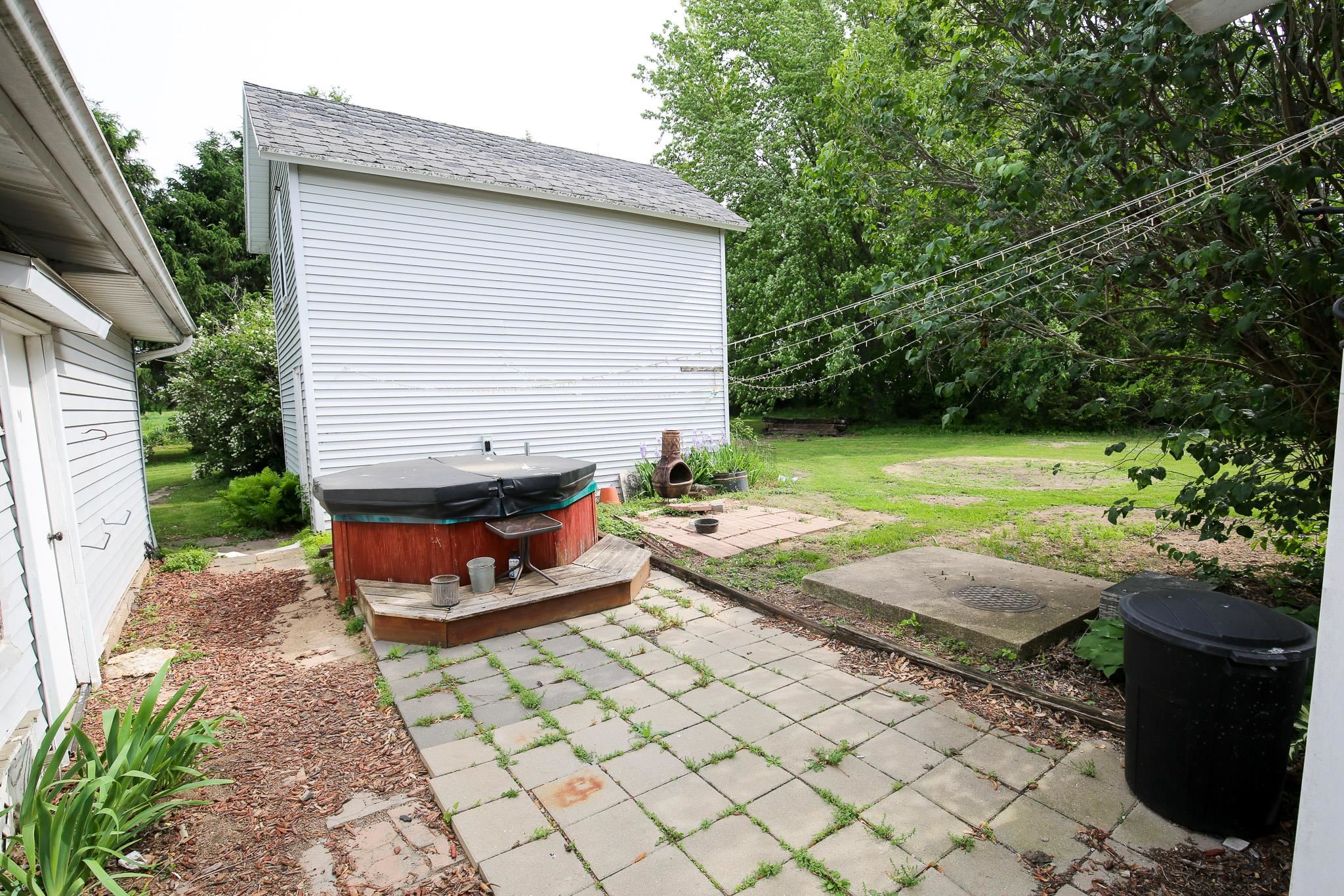 2144 Swarts Road Dixon, IL 61021 - Photo 20 of 31 a view of a backyard with chairs and a fire pit