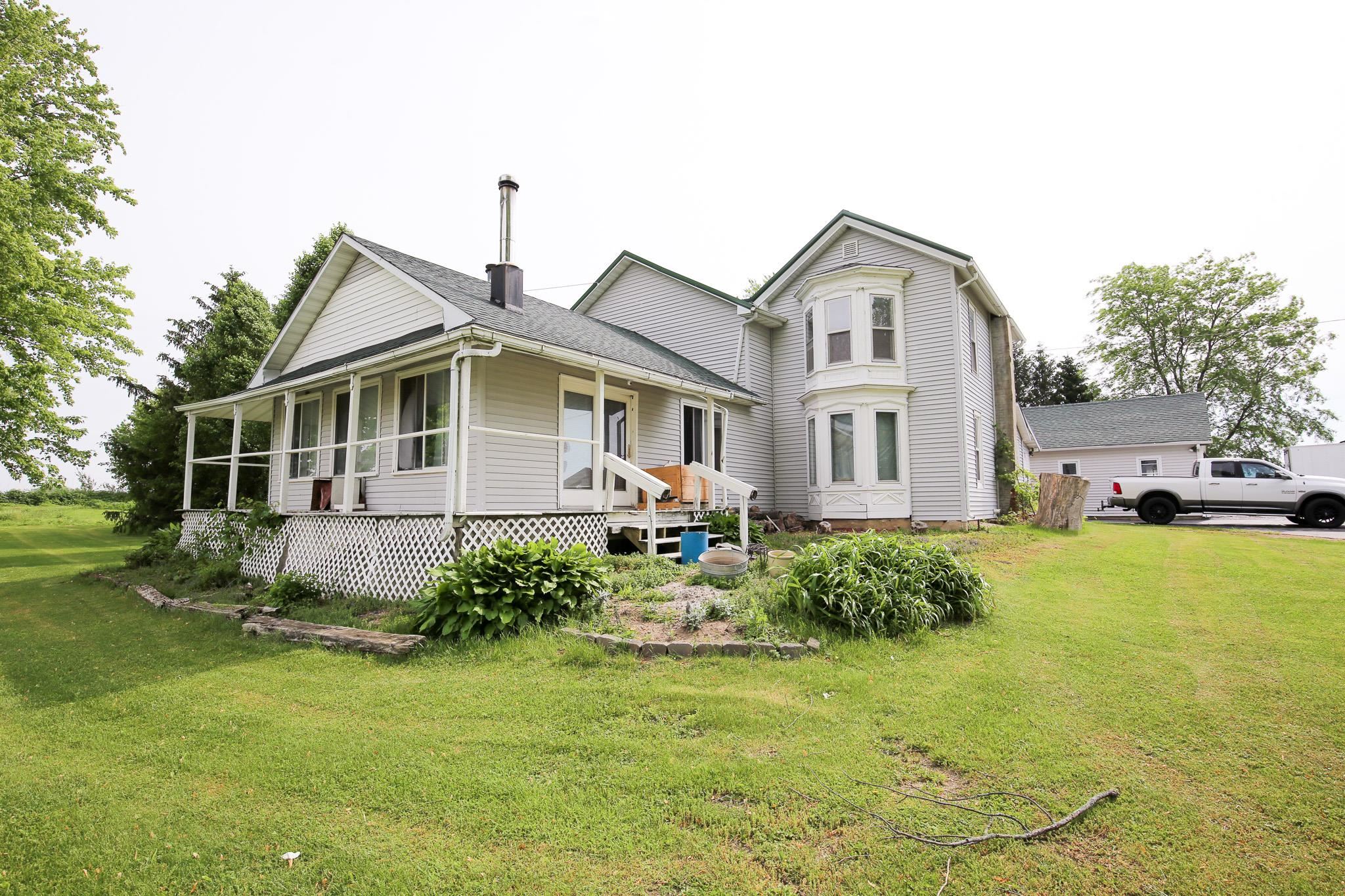 2144 Swarts Road Dixon, IL 61021 - Photo 2 of 31 a front view of a house with garden