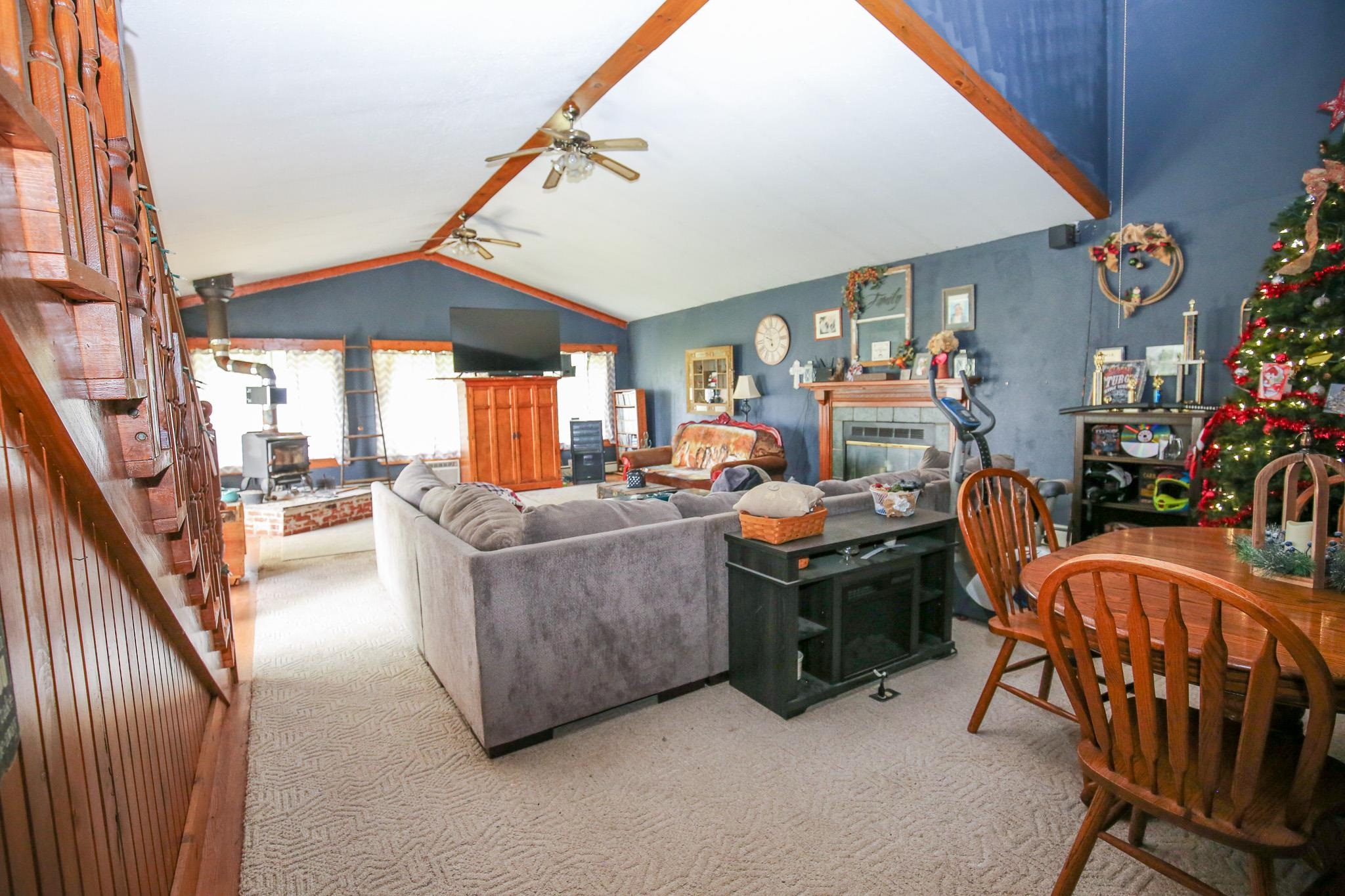 2144 Swarts Road Dixon, IL 61021 - Photo 4 of 31 a living room with furniture a fireplace and a large window