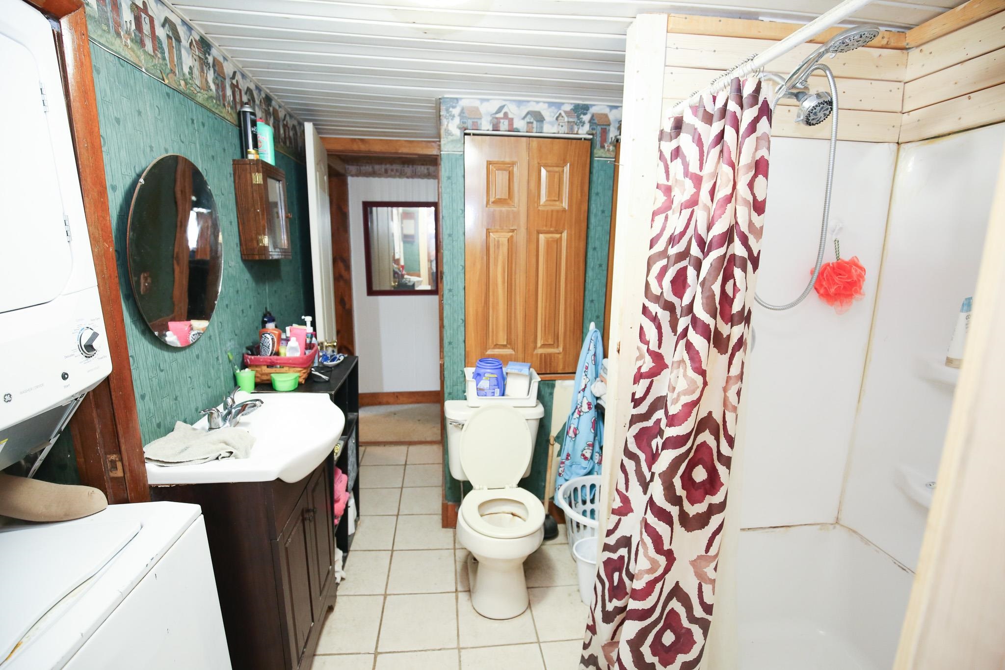 2144 Swarts Road Dixon, IL 61021 - Photo 10 of 31 a bathroom with a sink toilet and shower