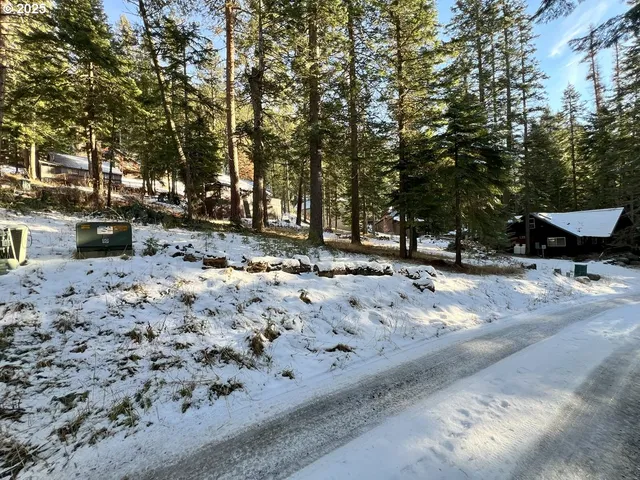 a view of snow on the side of the road