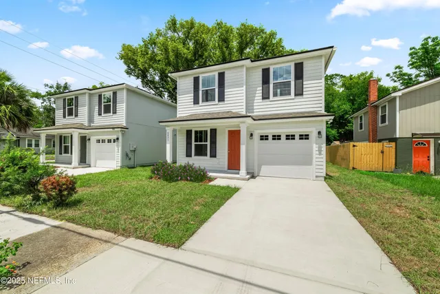 front view of a house with a yard