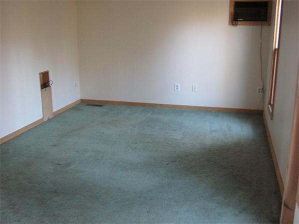 35 Cottage Road Dudley, MA 01571 - Photo 8 of 12 an empty room with a window
