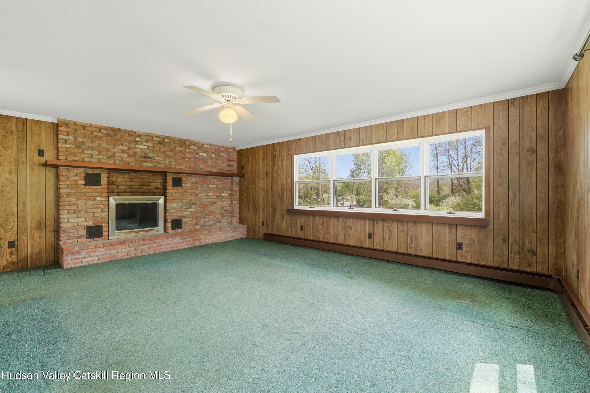 294 Kyserike Road Accord, NY 12404 - Photo 10 of 46 a view of an empty room with a window and fireplace