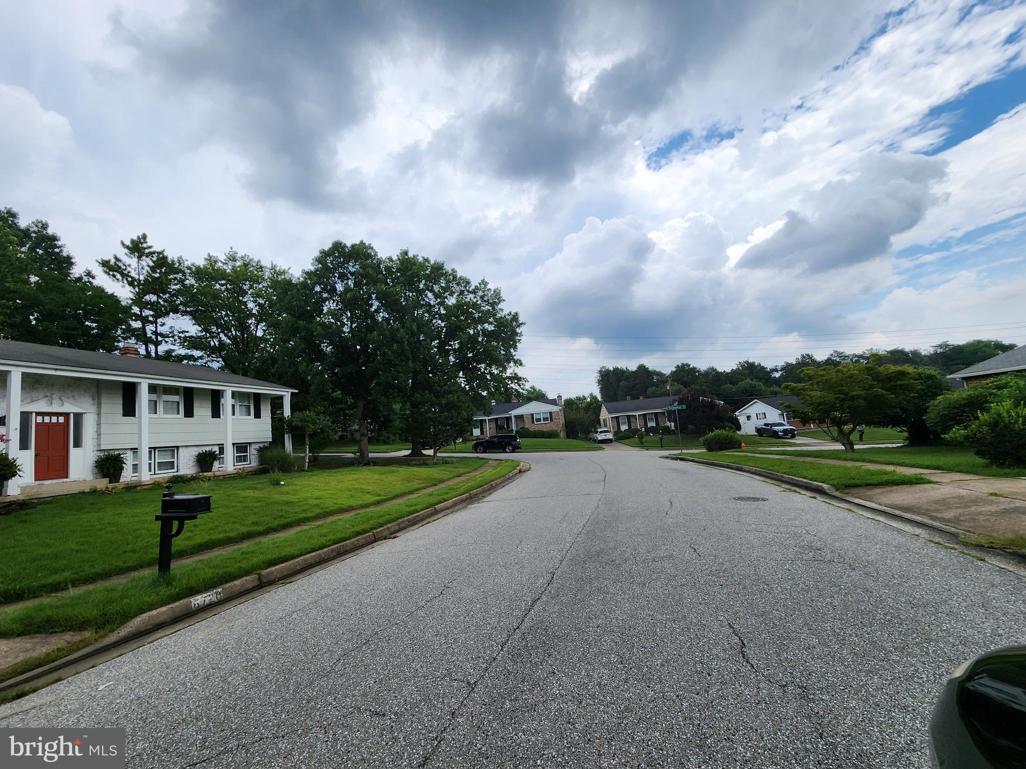 6720 Garvey Road Baltimore, MD 21237 - Photo 12 of 13 a view of a house with a big yard