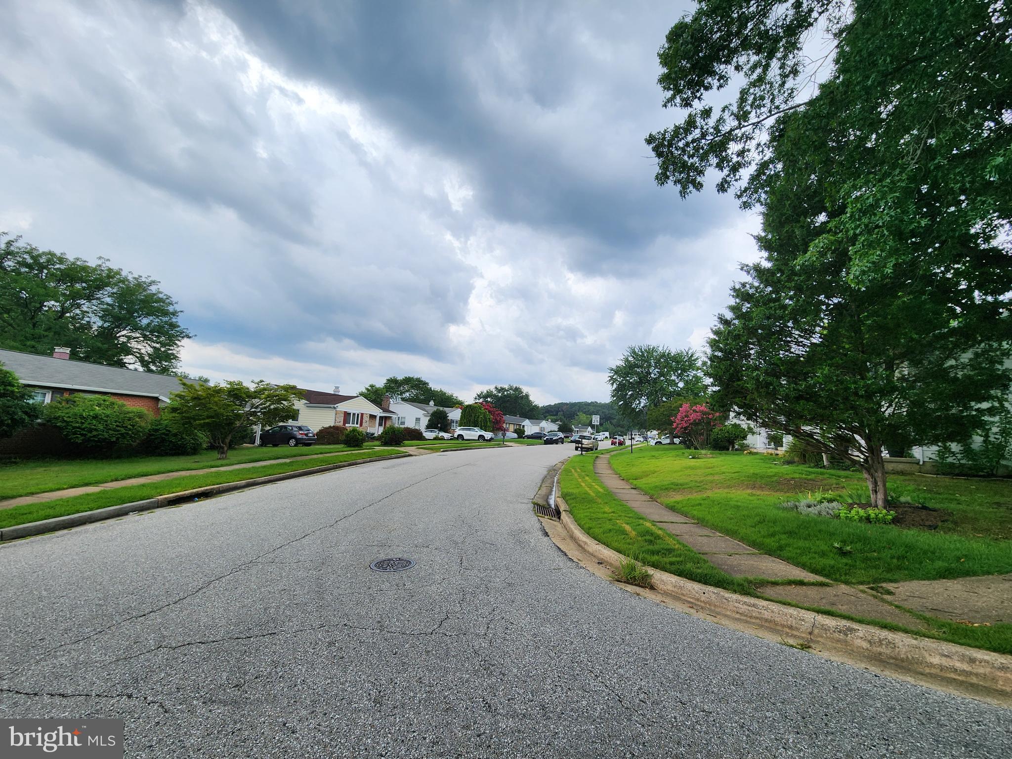 6720 Garvey Road Baltimore, MD 21237 - Photo 13 of 13 a view of a road with a big yard