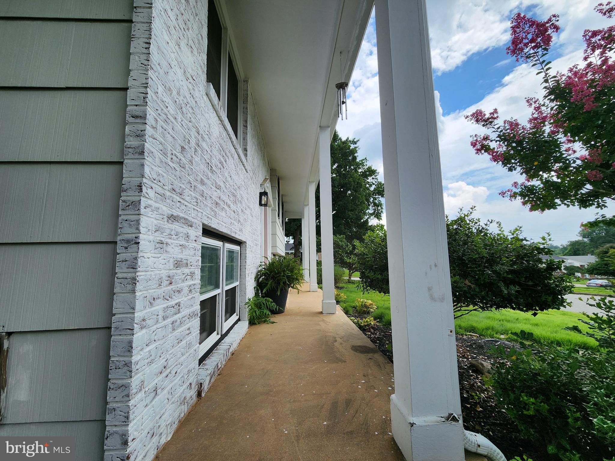 6720 Garvey Road Baltimore, MD 21237 - Photo 8 of 13 a front view of a house with a yard