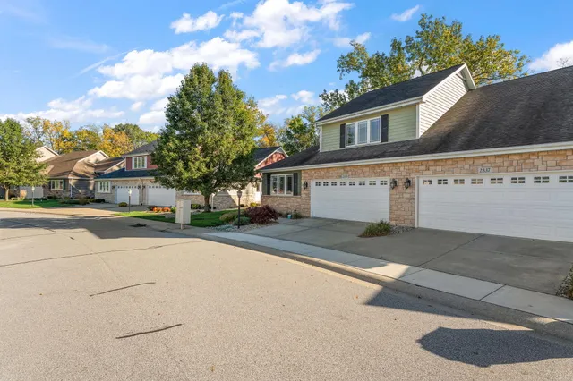 a front view of a house with a yard table and chairs