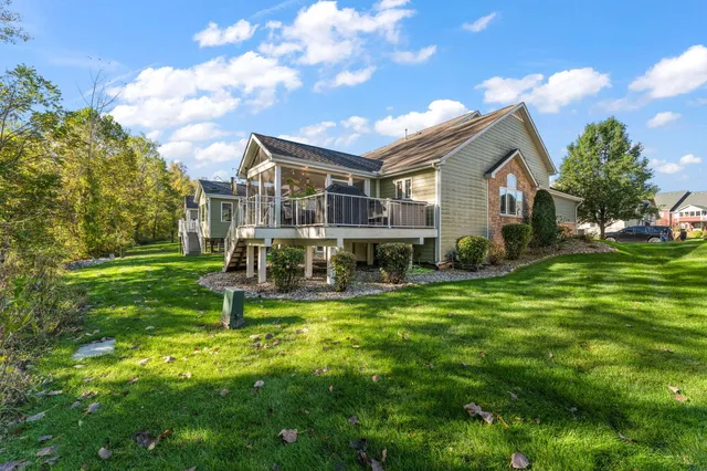 a view of a house with a yard porch and sitting area