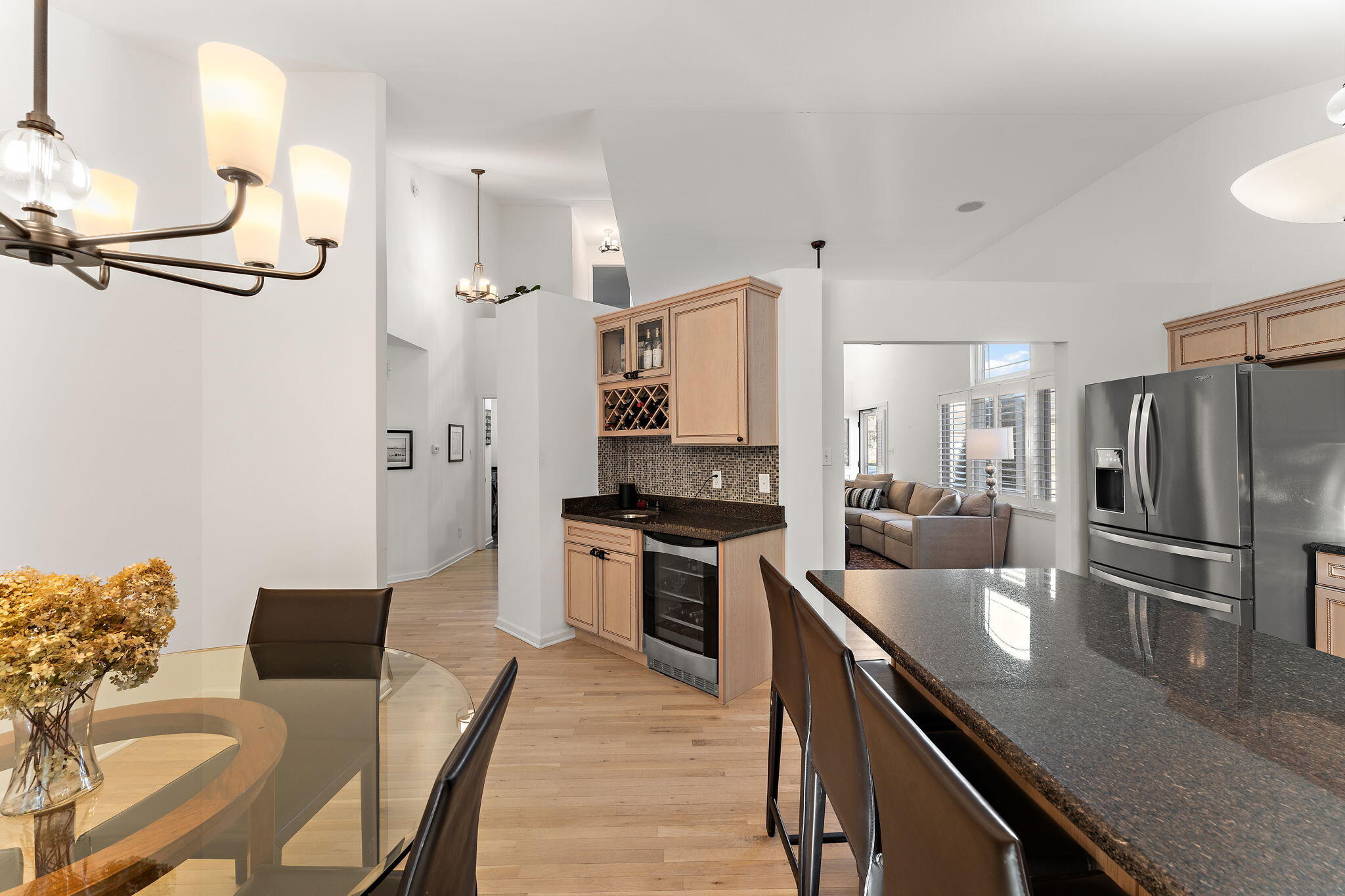 2335 Legend Circle Chesterton, IN 46304 - Photo 10 of 33 a kitchen with stainless steel appliances granite countertop a stove refrigerator and chairs