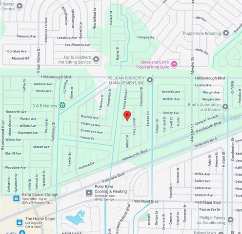 a street sign on a wall next to a building