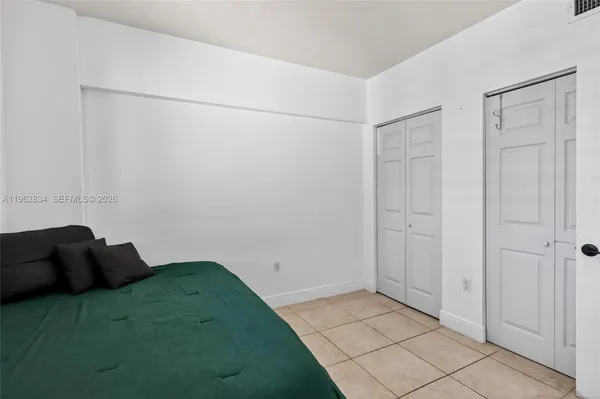 a bedroom with a bed and a cabinets