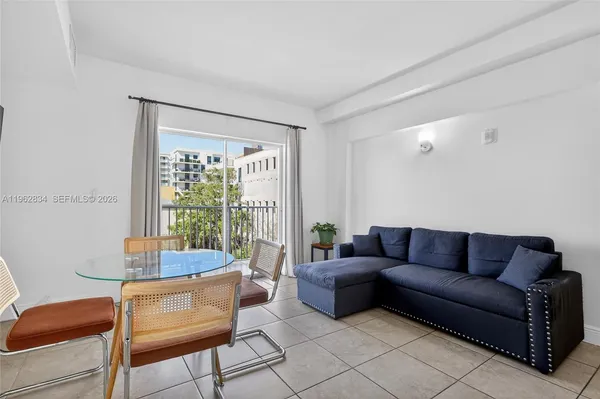 a living room with furniture and a window