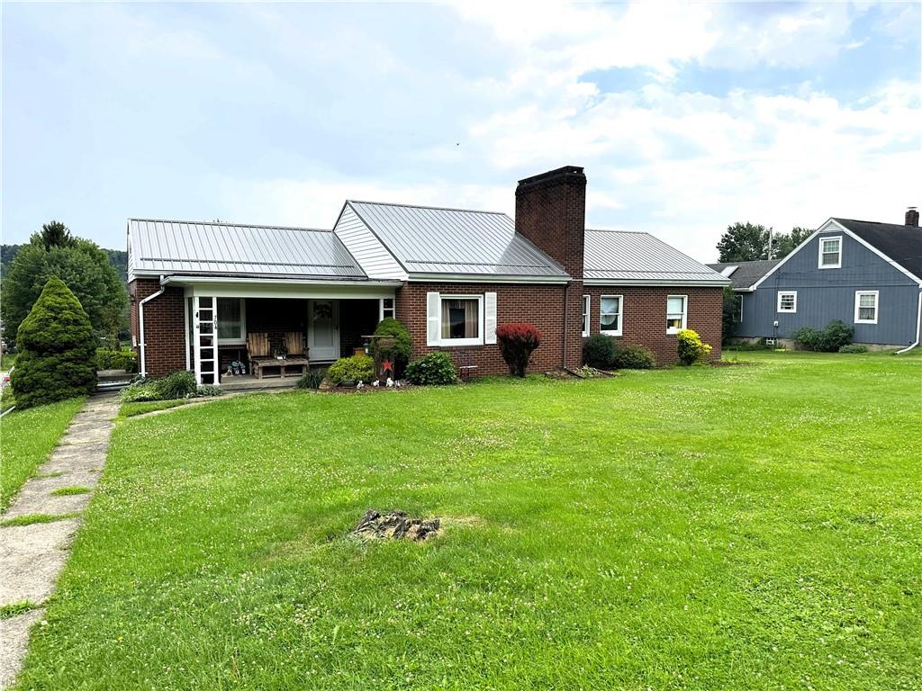 704 Middle 1st Street Rural Valley, PA 16249 - Photo 1 of 23 a front view of a house with a yard and green space