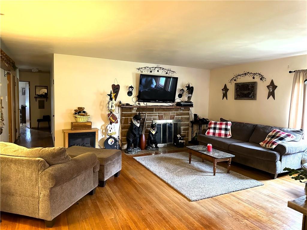 704 Middle 1st Street Rural Valley, PA 16249 - Photo 11 of 23 a living room with furniture and a flat screen tv