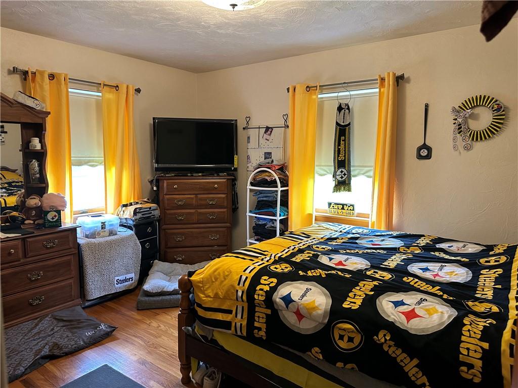 704 Middle 1st Street Rural Valley, PA 16249 - Photo 15 of 23 a bedroom with a bed and a flat screen tv
