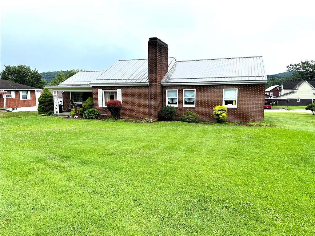 704 Middle 1st Street Rural Valley, PA 16249 - Photo 22 of 23 a front view of a house with a garden