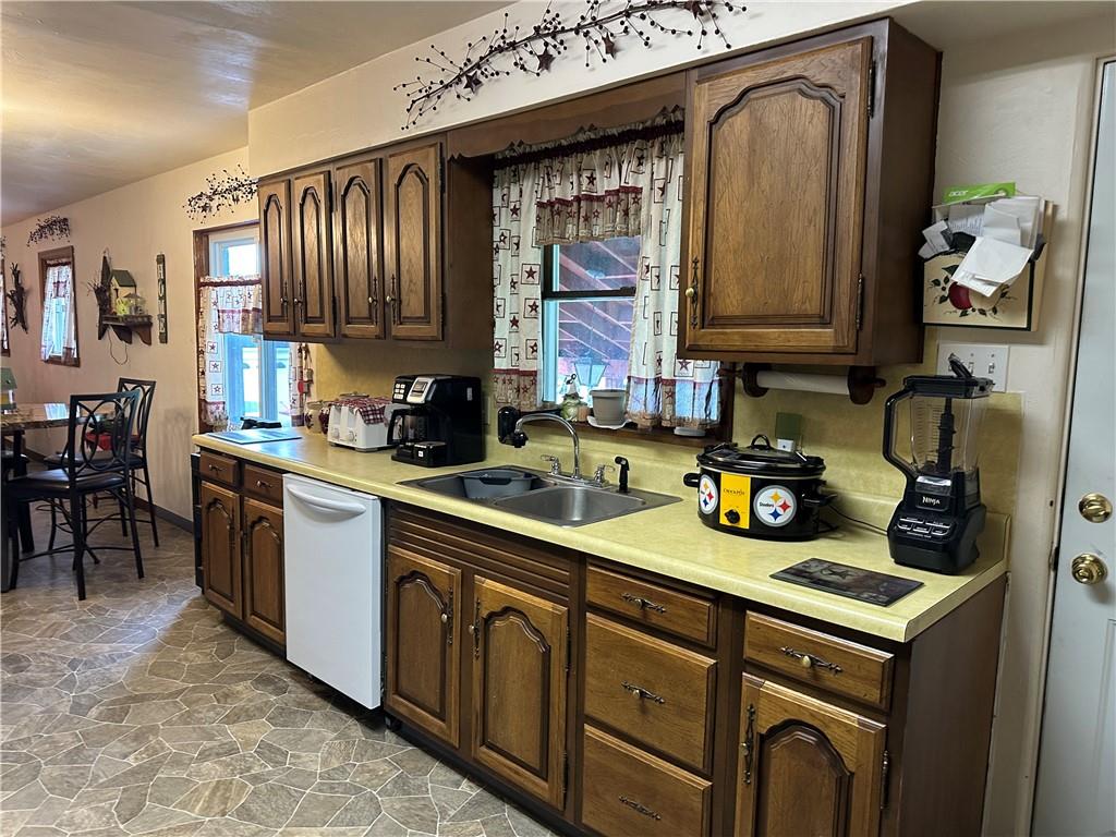 704 Middle 1st Street Rural Valley, PA 16249 - Photo 3 of 23 a kitchen with sink cabinets and window
