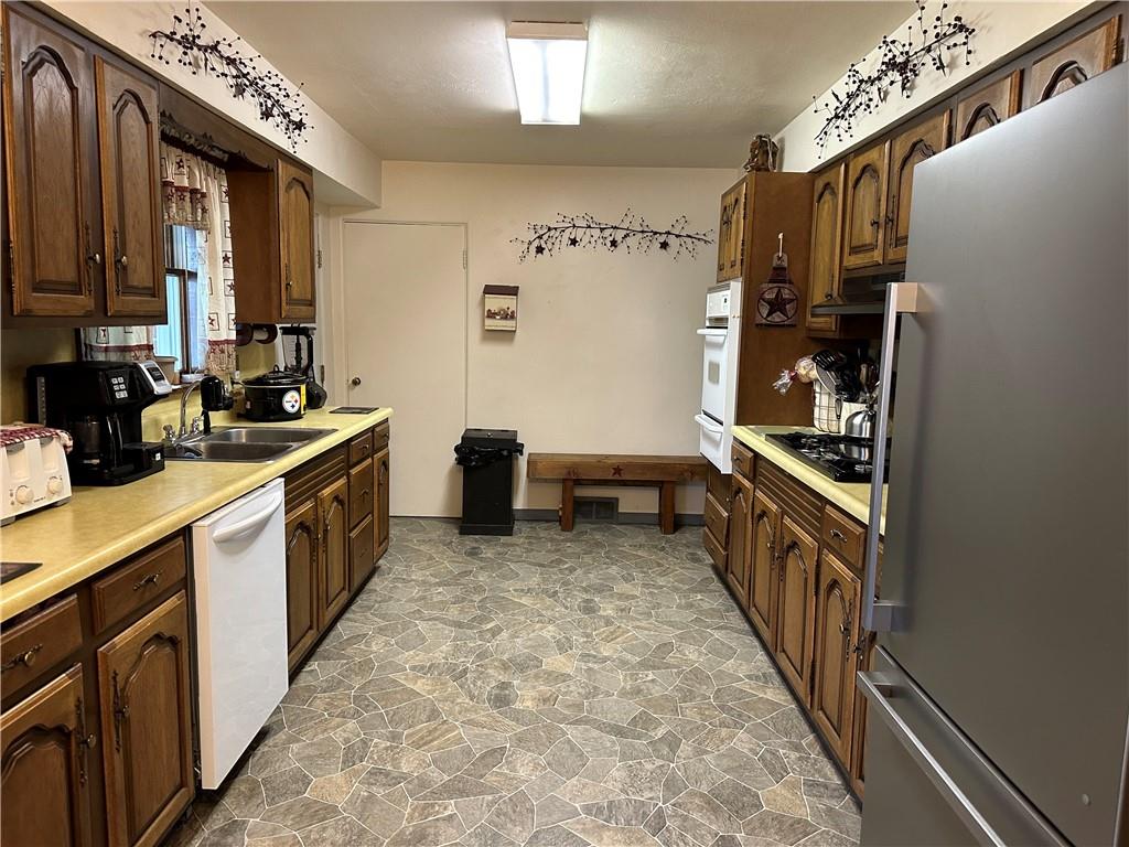 704 Middle 1st Street Rural Valley, PA 16249 - Photo 5 of 23 a kitchen with sink cabinets and stove