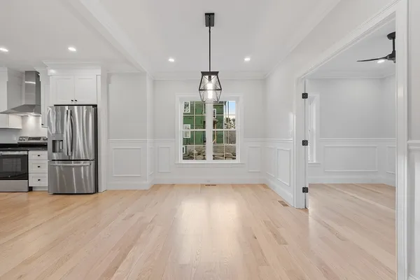 a view of wooden floor and windows in a room