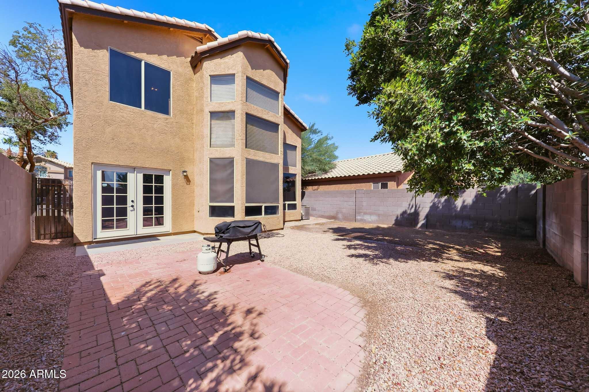 2167 East Nighthawk Way Phoenix, AZ 85048 - Photo 6 of 28 a view of a backyard with a sitting area