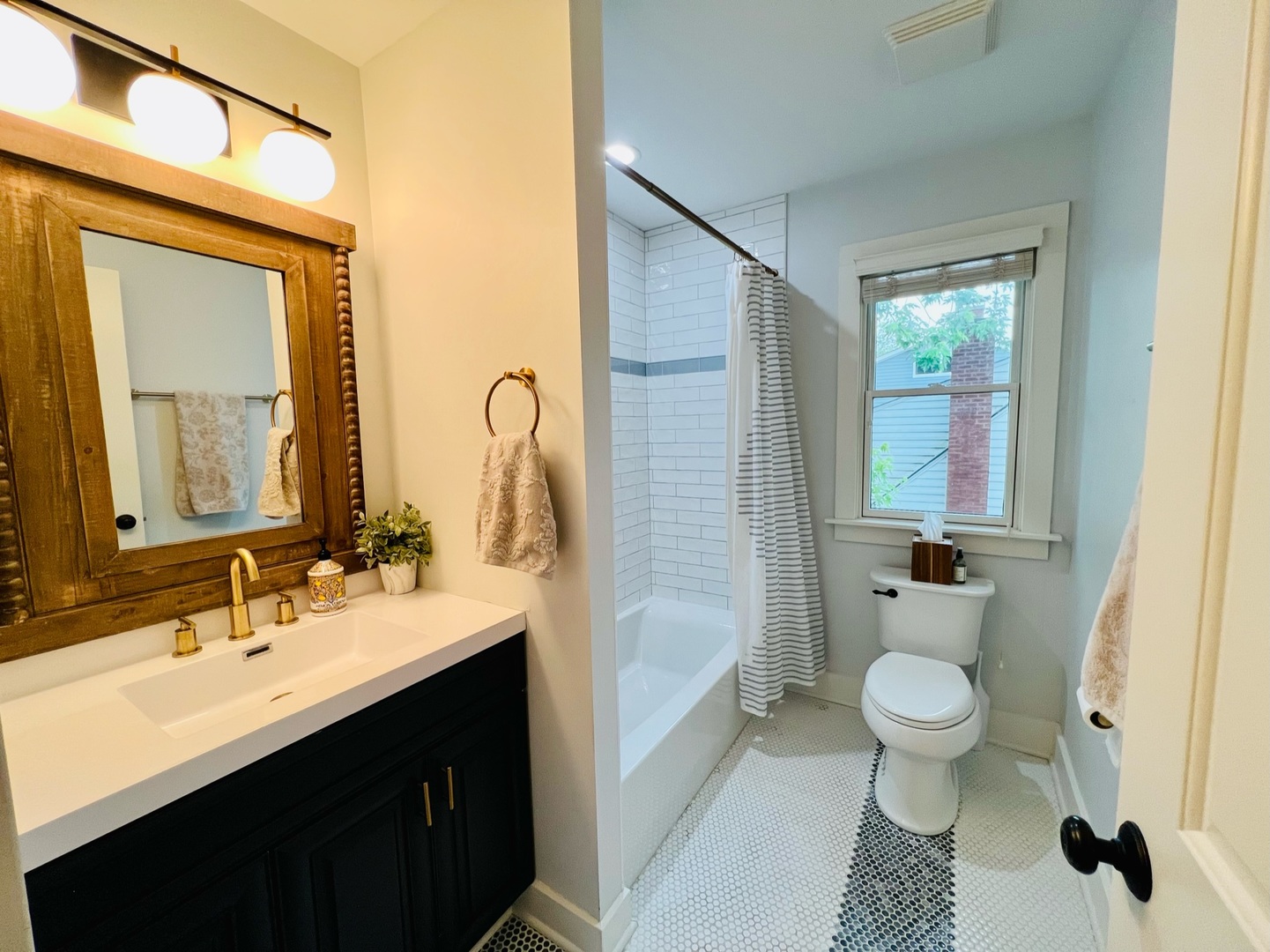 1105 Harrison Street Park Ridge, IL 60068 - Photo 20 of 29 a bathroom with a granite countertop sink a toilet and shower