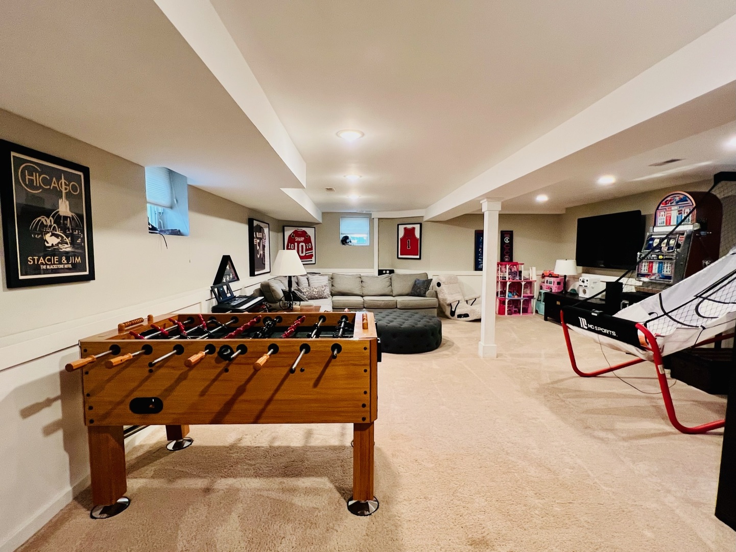1105 Harrison Street Park Ridge, IL 60068 - Photo 23 of 29 a living room with furniture a air conditioner and a flat screen tv
