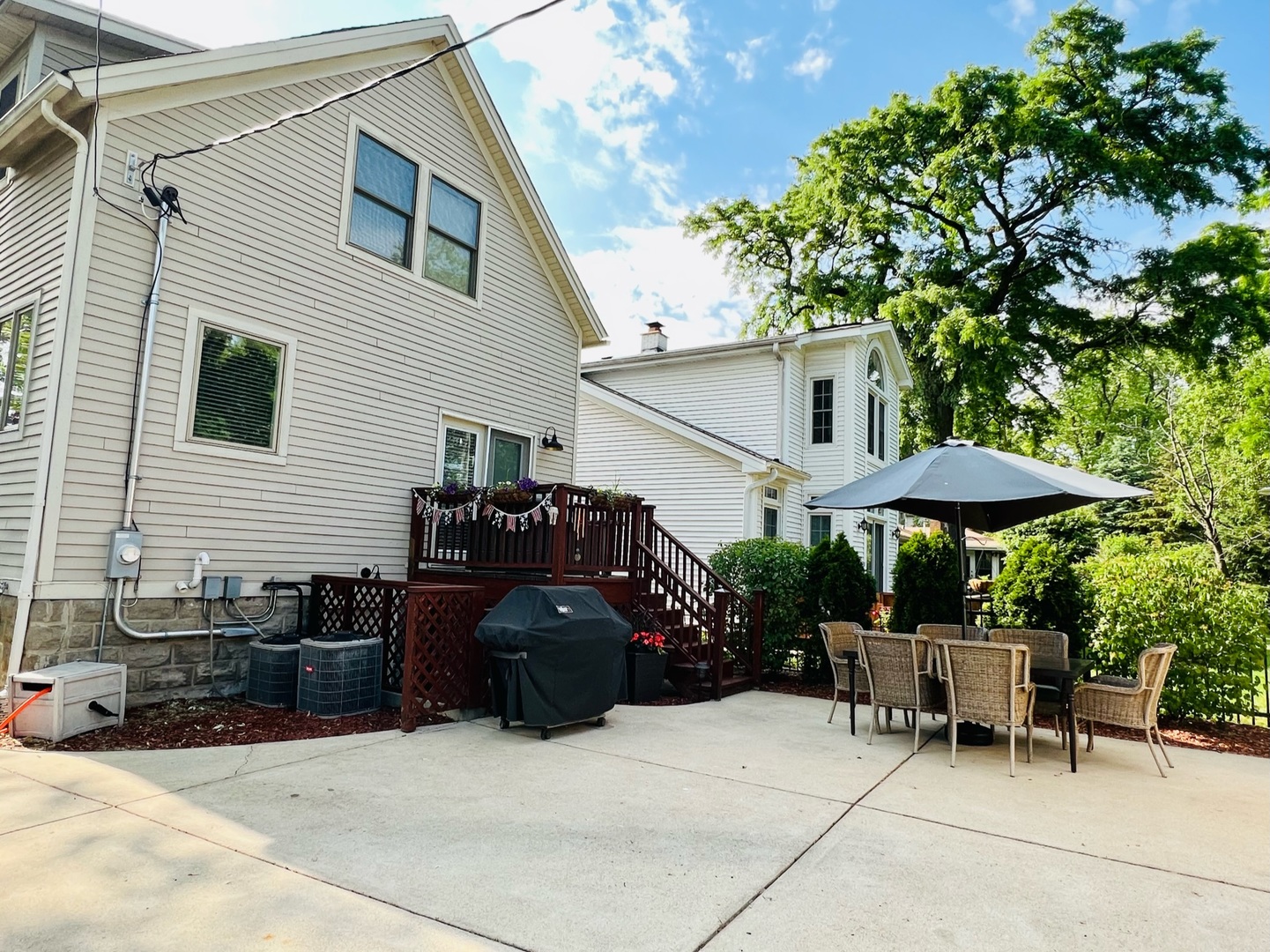 1105 Harrison Street Park Ridge, IL 60068 - Photo 29 of 29 a view of a patio with a table and chairs under an umbrella