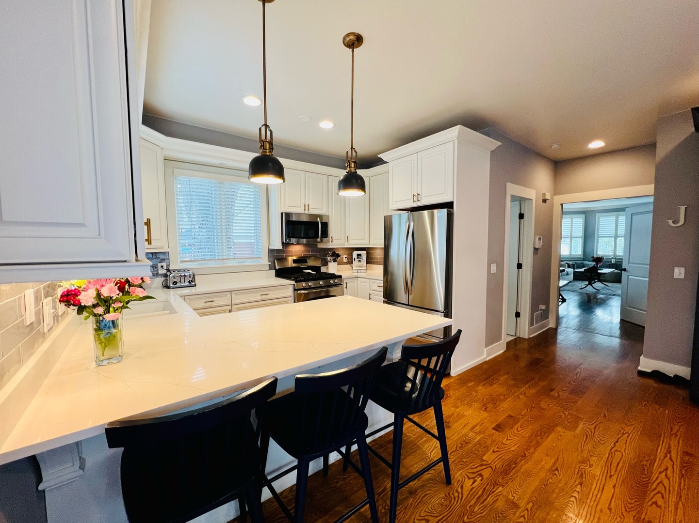 1105 Harrison Street Park Ridge, IL 60068 - Photo 8 of 29 a kitchen with stainless steel appliances kitchen island granite countertop a table chairs and a refrigerator